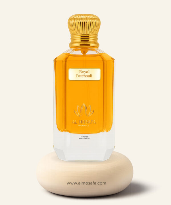 The luxurious Royal Patchouli perfume in a golden-hued, Tom Ford-style glass bottle with a black cap, set beside artistic representations of its key notes: patchouli leaves, cinnamon sticks, and vanilla pods.